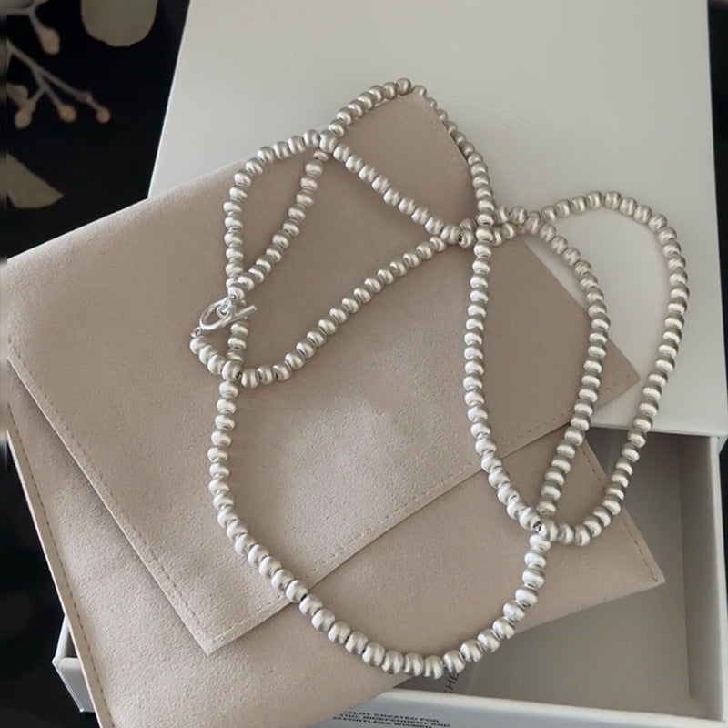 brushed metal sphere necklace set | minimalist long sweater chain & earrings with modern luxury design